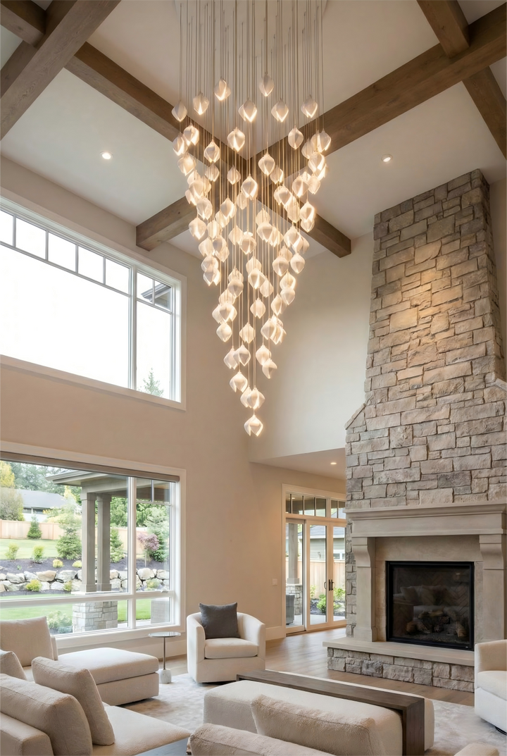 Modern living room with a chandelier, fireplace, and large windows.